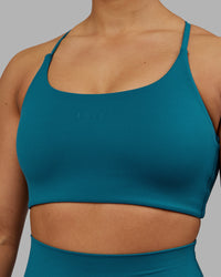 Woman wearing Twist Sports Bra - Blue Coral | Model:Ayla | Size:S | Thumbnail Index: 3