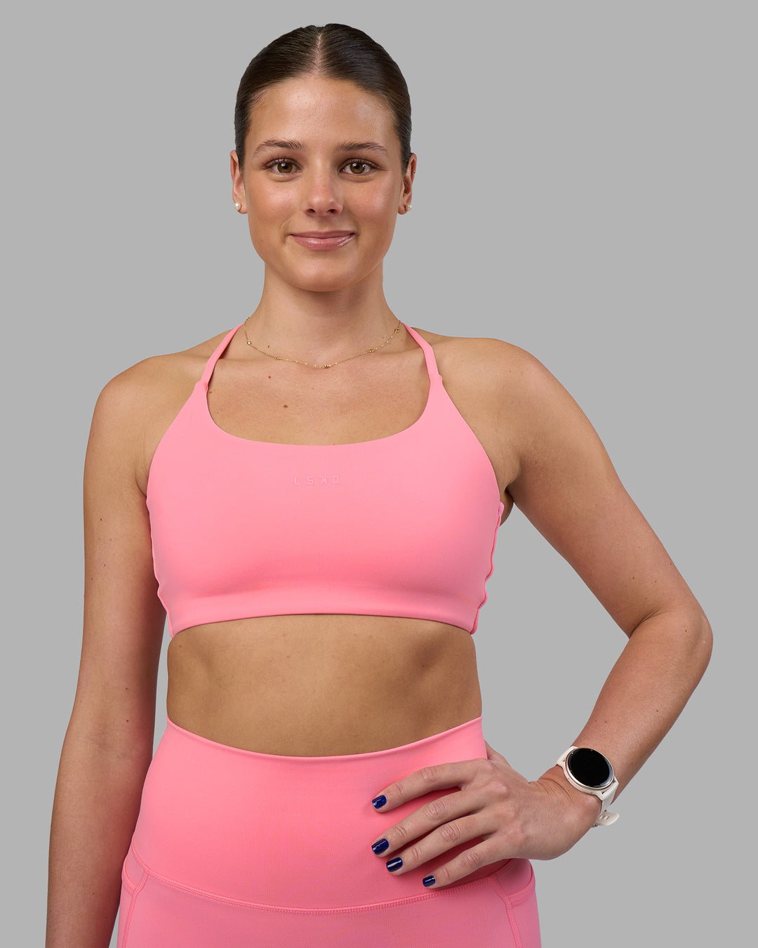 Woman wearing Twist Sports Bra - Candy Pink | Model:Phoebe | Size:S - view 1