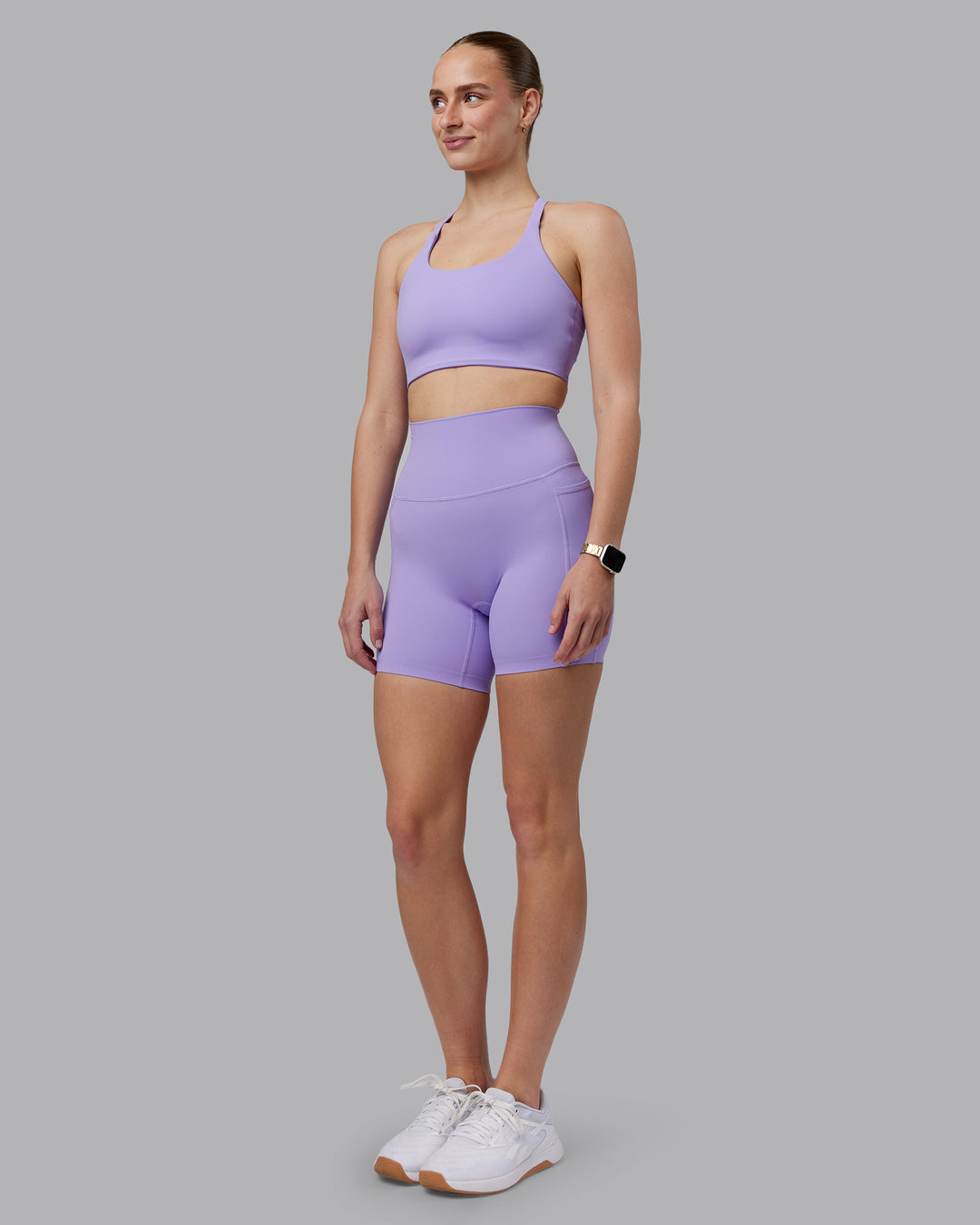 Woman wearing Twist Sports Bra D/DD/E - Violet Ray | Model:Lillie | Size:S - view 5