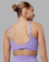 Woman wearing Twist Sports Bra D/DD/E - Violet Ray | Model:Lillie | Size:S | Thumbnail Index: 2