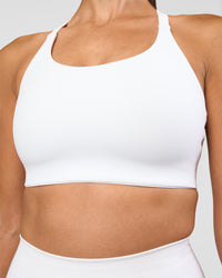 Woman wearing Twist Sports Bra D/DD/E - White | Model:Rhiley | Size:S | Thumbnail Index: 4