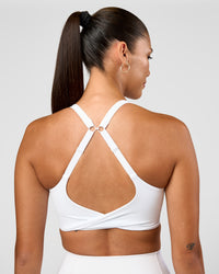 Woman wearing Twist Sports Bra D/DD/E - White | Model:Rhiley | Size:S | Thumbnail Index: 1