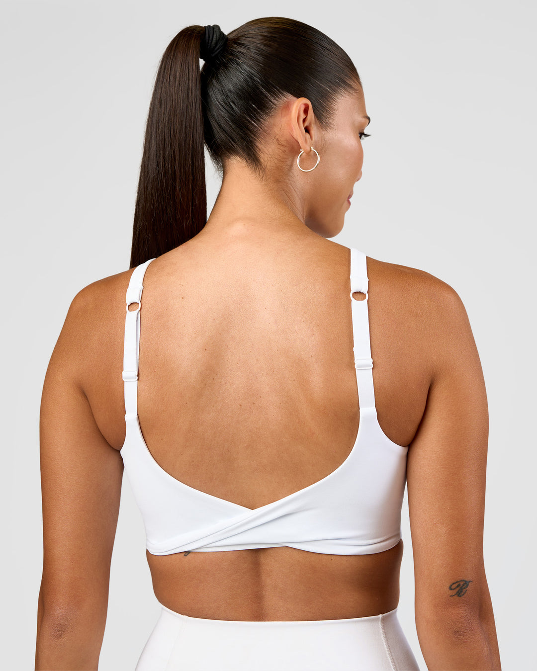 Woman wearing Twist Sports Bra D/DD/E - White | Model:Rhiley | Size:S - view 3