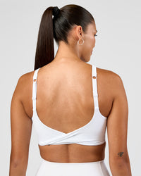 Woman wearing Twist Sports Bra D/DD/E - White | Model:Rhiley | Size:S | Thumbnail Index: 2