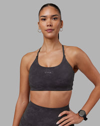 Woman wearing Twist Sports Bra - Dark Storm Wash | Model:Rhiley | Size:S | Thumbnail Index: 0