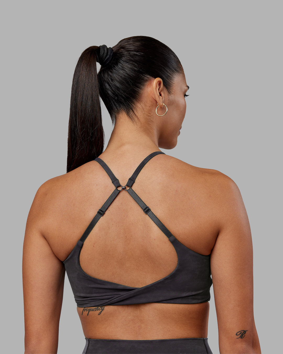 Woman wearing Twist Sports Bra - Dark Storm Wash | Model:Rhiley | Size:S - view 2