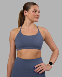 Woman wearing Twist Sports Bra - Night Shadow | Model:Phoebe | Size:S | Thumbnail Index: 1