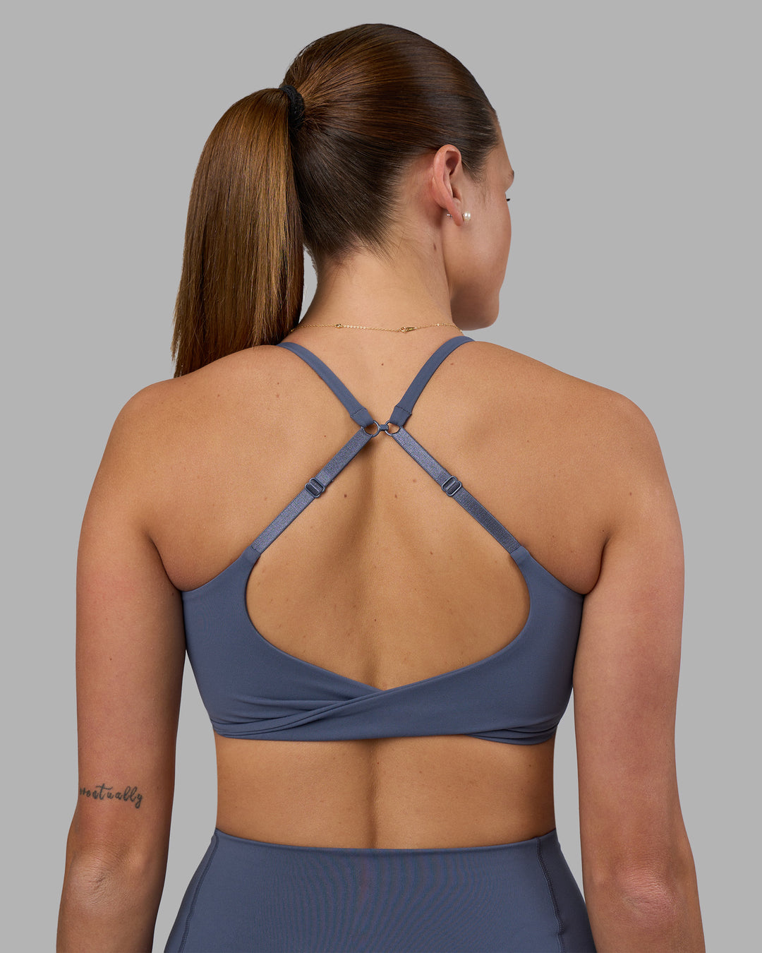 Woman wearing Twist Sports Bra - Night Shadow | Model:Phoebe | Size:S - view 4
