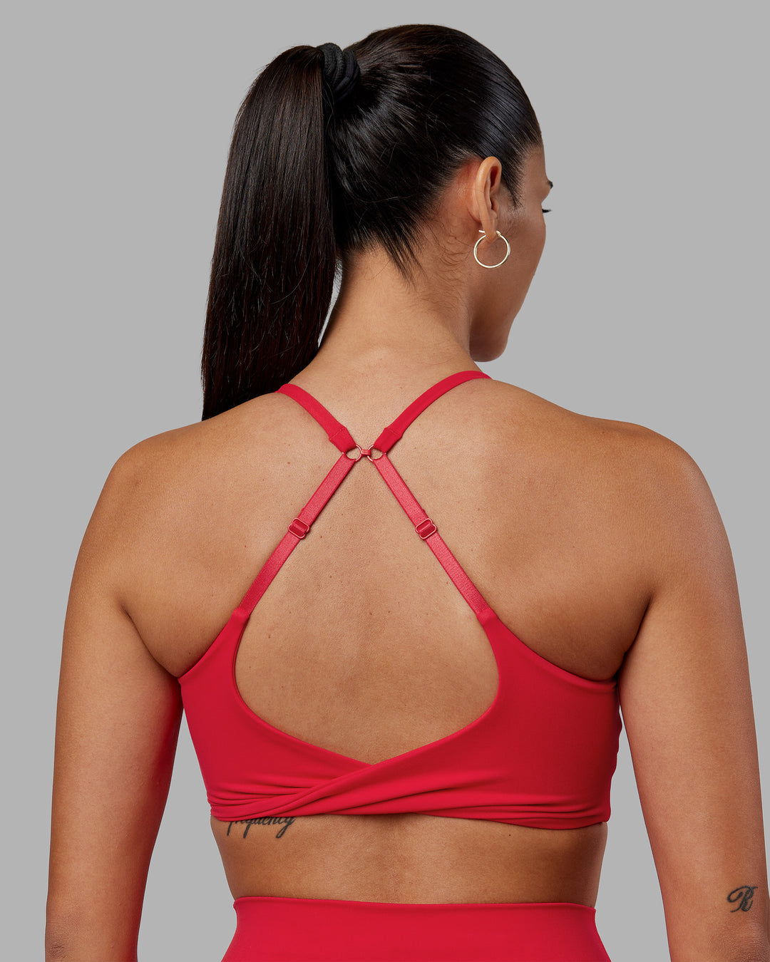 Woman wearing Twist Sports Bra - Scarlet | Model:Rhiley | Size:S - view 2