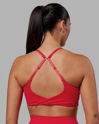 Woman wearing Twist Sports Bra - Scarlet | Model:Rhiley | Size:S | Thumbnail Index: 1