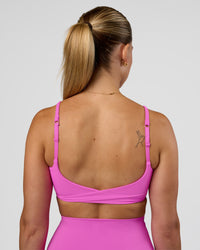 Woman wearing Twist Sports Bra - Ultra Fuchsia | Model:Myrte | Size:S | Thumbnail Index: 4