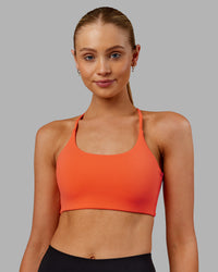Woman wearing Twist Sports Bra - Ultra Orange | Model:Ella | Size:S | Thumbnail Index: 2