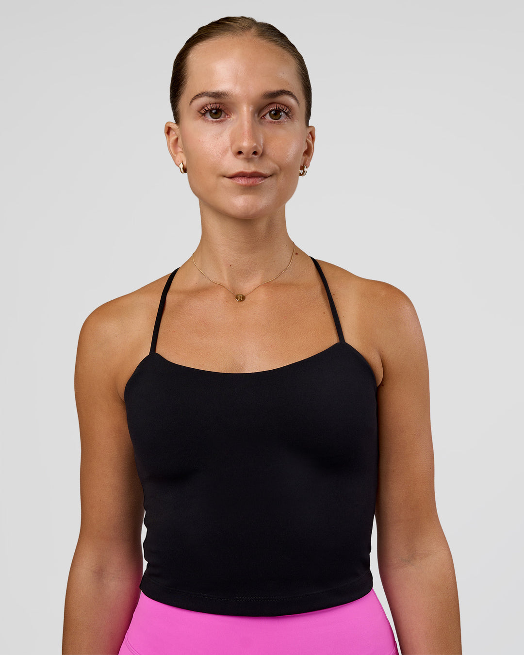 Woman wearing Twister Shelf Bra Tank - Black | Model:Myrte | Size:S - view 1