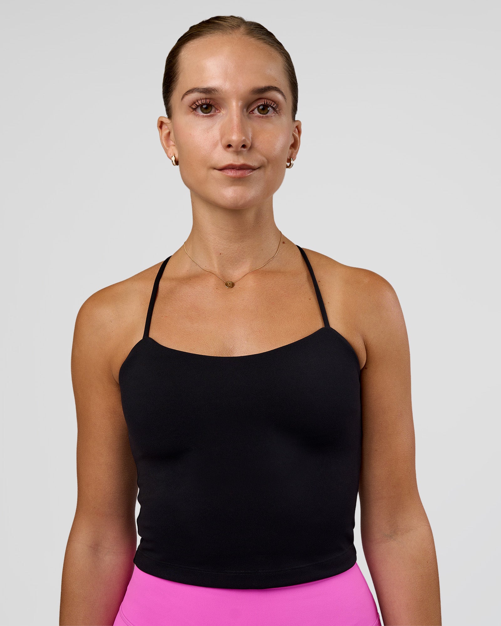 Woman wearing Twister Shelf Bra Tank - Black | Model:Myrte | Size:S