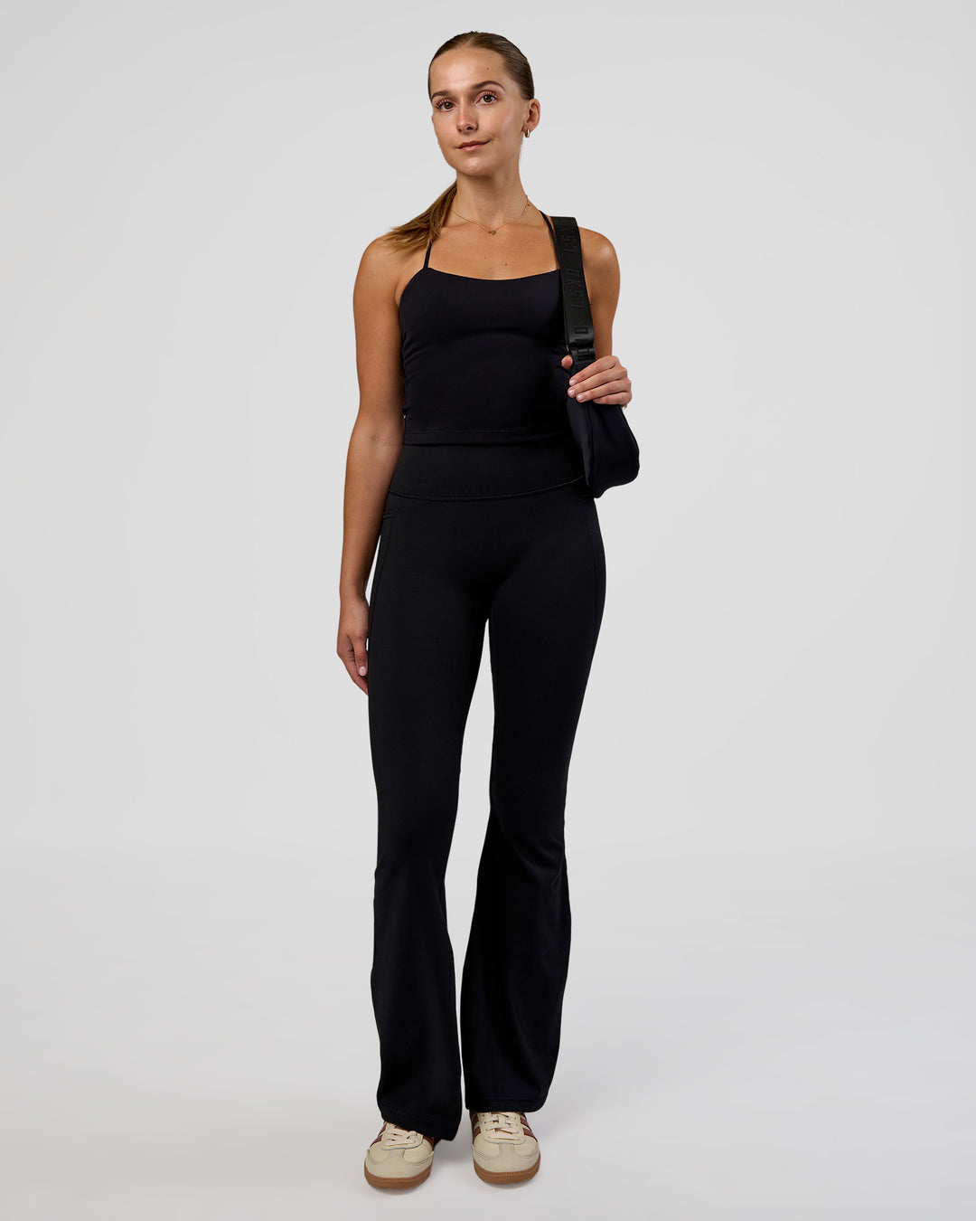 Woman wearing Twister Shelf Bra Tank - Black | Model:Myrte | Size:S - view 4