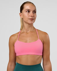 Woman wearing Twister Sports Bra - Candy Pink | Model:Myrte | Size:S | Thumbnail Index: 1