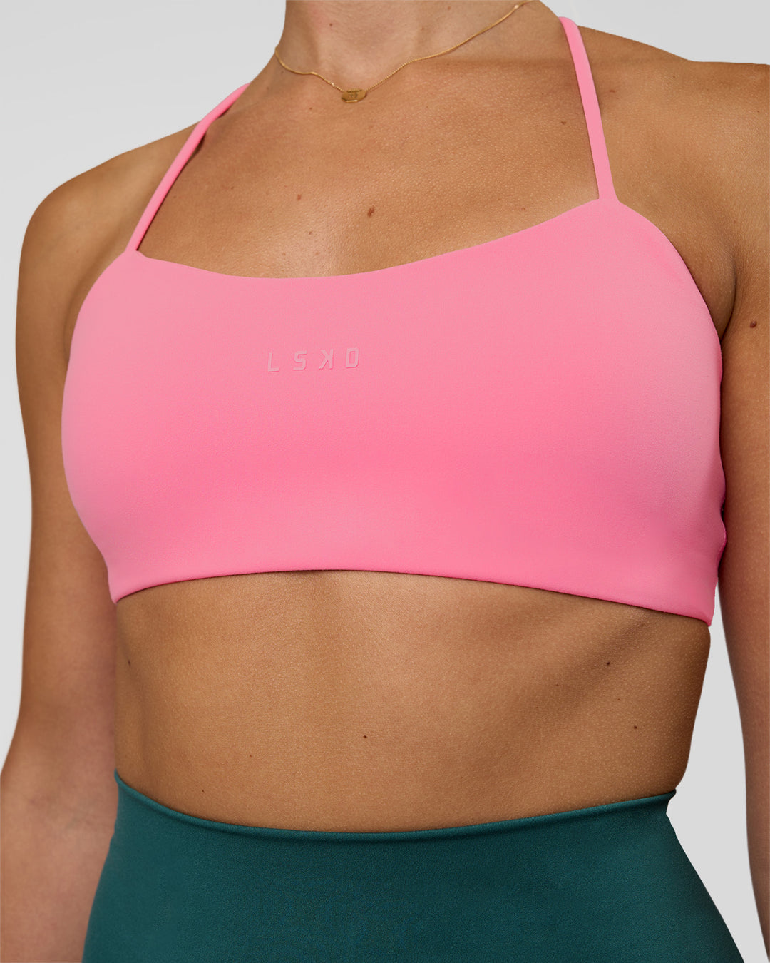 Woman wearing Twister Sports Bra - Candy Pink | Model:Myrte | Size:S - view 4
