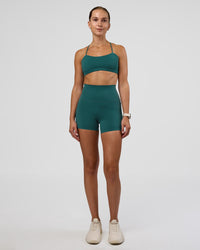 Woman wearing Twister Sports Bra - Transformative Teal | Model:Myrte | Size:S | Thumbnail Index: 3