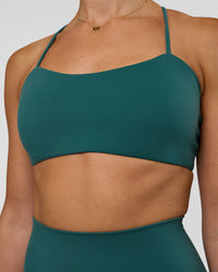 Woman wearing Twister Sports Bra - Transformative Teal | Model:Myrte | Size:S | Thumbnail Index: 2