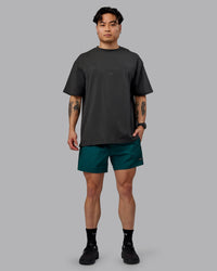 Man wearing Unisex 1% Better FLXCotton Tee Oversize - Pirate Black-Black | Thumbnail Index: 9