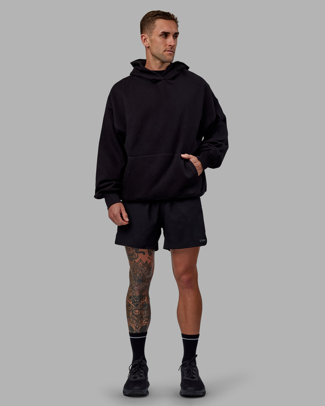 Man wearing Unisex Keep on Running Hoodie Oversize - Black-White - view 12
