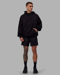 Man wearing Unisex Keep on Running Hoodie Oversize - Black-White | Thumbnail Index: 11