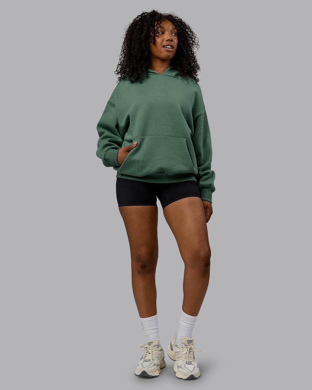 Woman wearing Unisex MVP Hoodie Oversize - Sage Brush - view 5