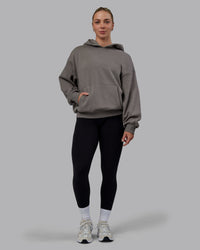 Woman wearing Unisex MVP Hoodie Oversize - Storm Front | Thumbnail Index: 3