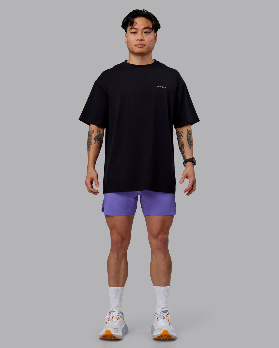 Man wearing Unisex RUN CLUB FLXCotton Tee Oversize - Black-Purple Swirl - view 11