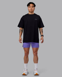 Man wearing Unisex RUN CLUB FLXCotton Tee Oversize - Black-Purple Swirl | Thumbnail Index: 10