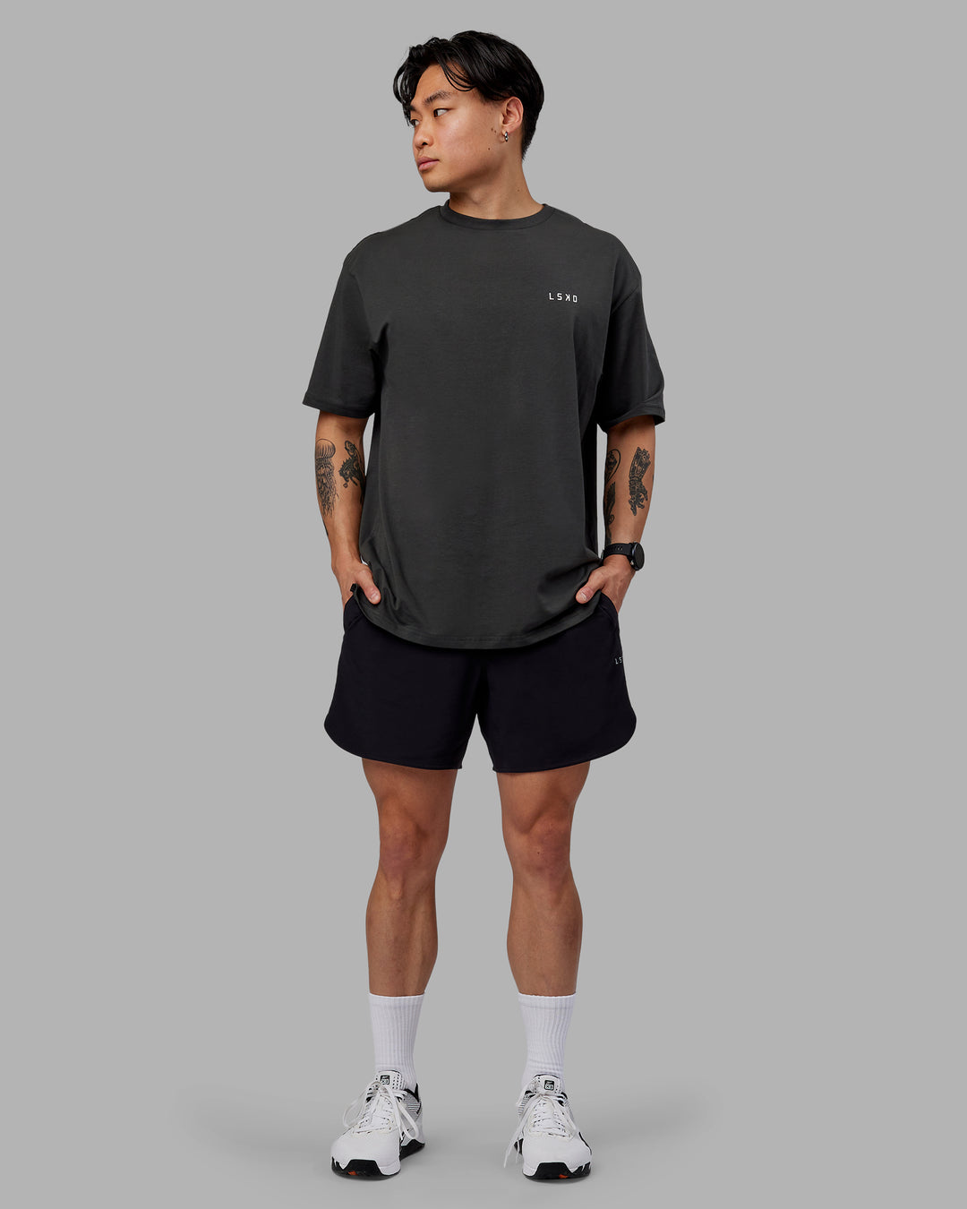 Man wearing Unisex Strike Through FLXCotton Tee Oversize - Pirate Black-Black - view 10