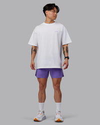 Man wearing Unisex Strike Through FLXCotton Tee Oversize - White-Purple Swirl | Thumbnail Index: 10
