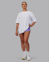 Woman wearing Unisex Strike Through FLXCotton Tee Oversize - White-Purple Swirl | Thumbnail Index: 7