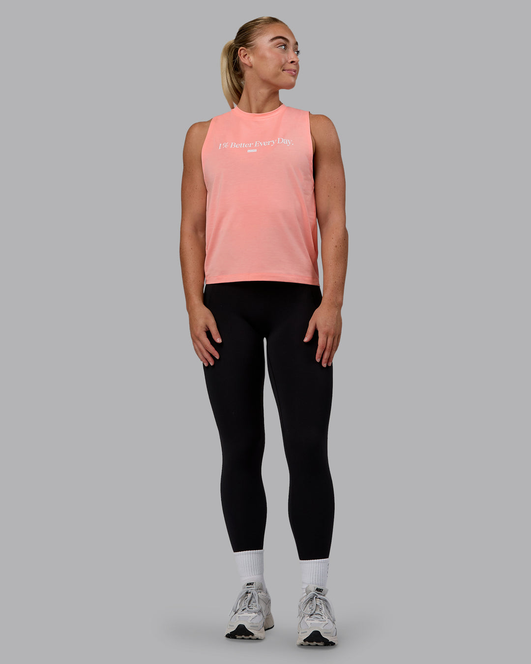Woman wearing Unleash 1% Better Training Tank - Murex Shell-White - view 5