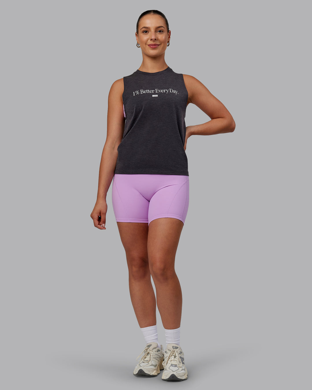Woman wearing Unleash 1% Better Training Tank - Charcoal Marl-White - view 5