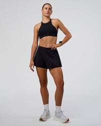 Woman wearing Unstoppable Lined Short - Black | Model:Emelia | Size:S | Thumbnail Index: 1