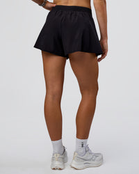Woman wearing Unstoppable Lined Short - Black | Model:Emelia | Size:S | Thumbnail Index: 2