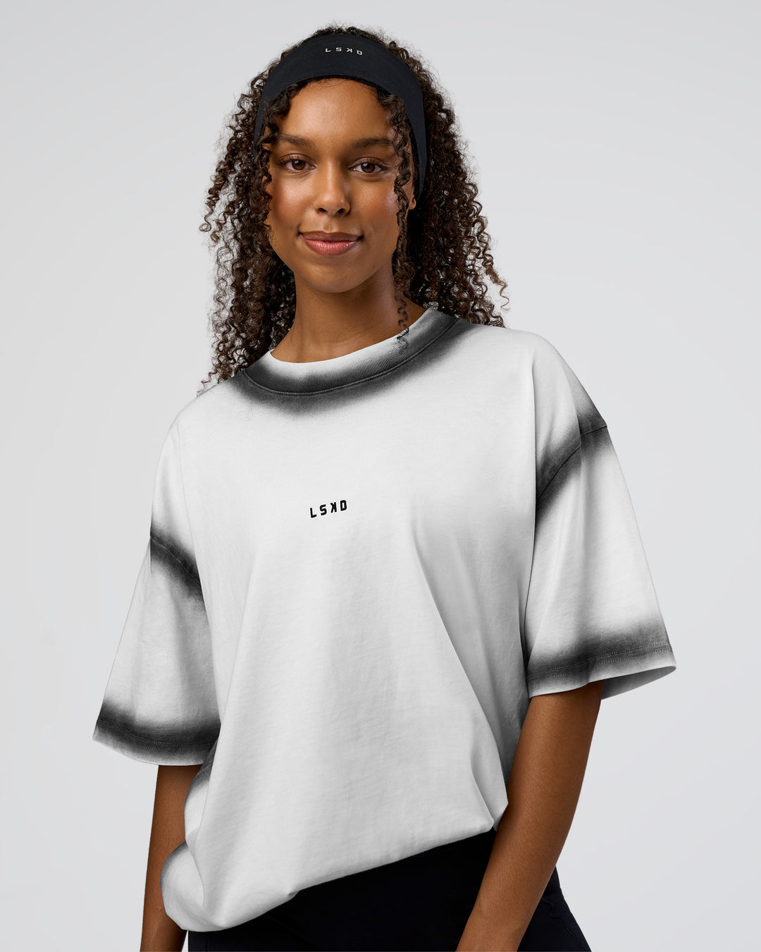Woman wearing Urban Blur Heavyweight Unisex Oversized Tee - White-Black | Model:Jordan | Size:S - view 4
