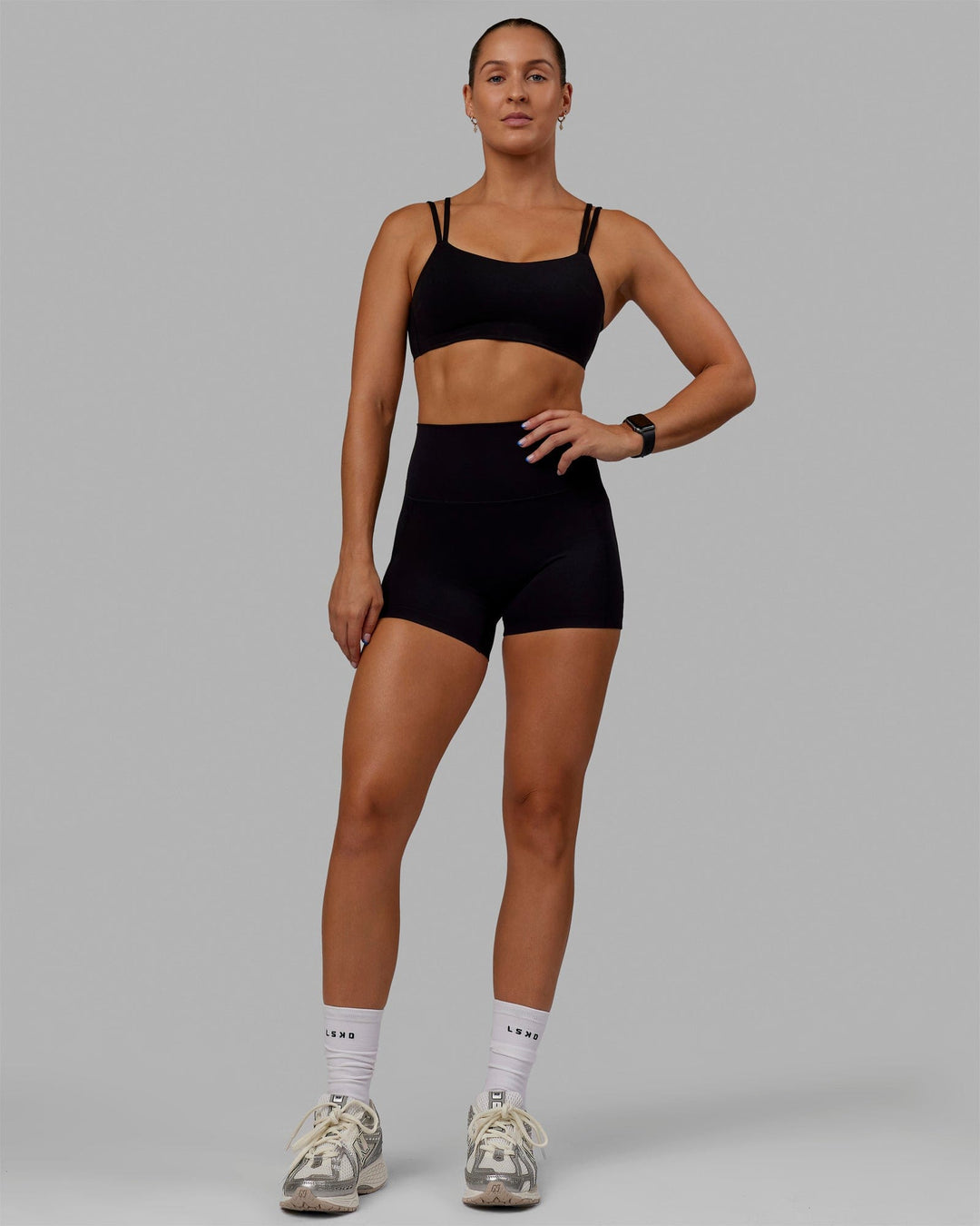 Woman wearing Vantage Sports Bra - Black - view 4