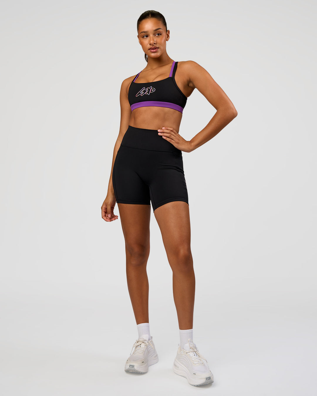 Woman wearing Velocity Graphic Sports Bra - Black-Radiate | Model:Rosie | Size:S - view 4