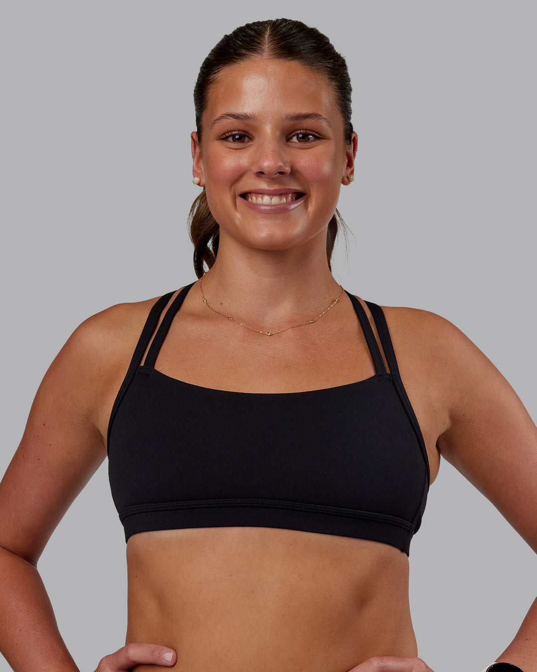 Woman wearing Velocity Sports Bra - Black | Model:Phoebe | Size:S - view 1