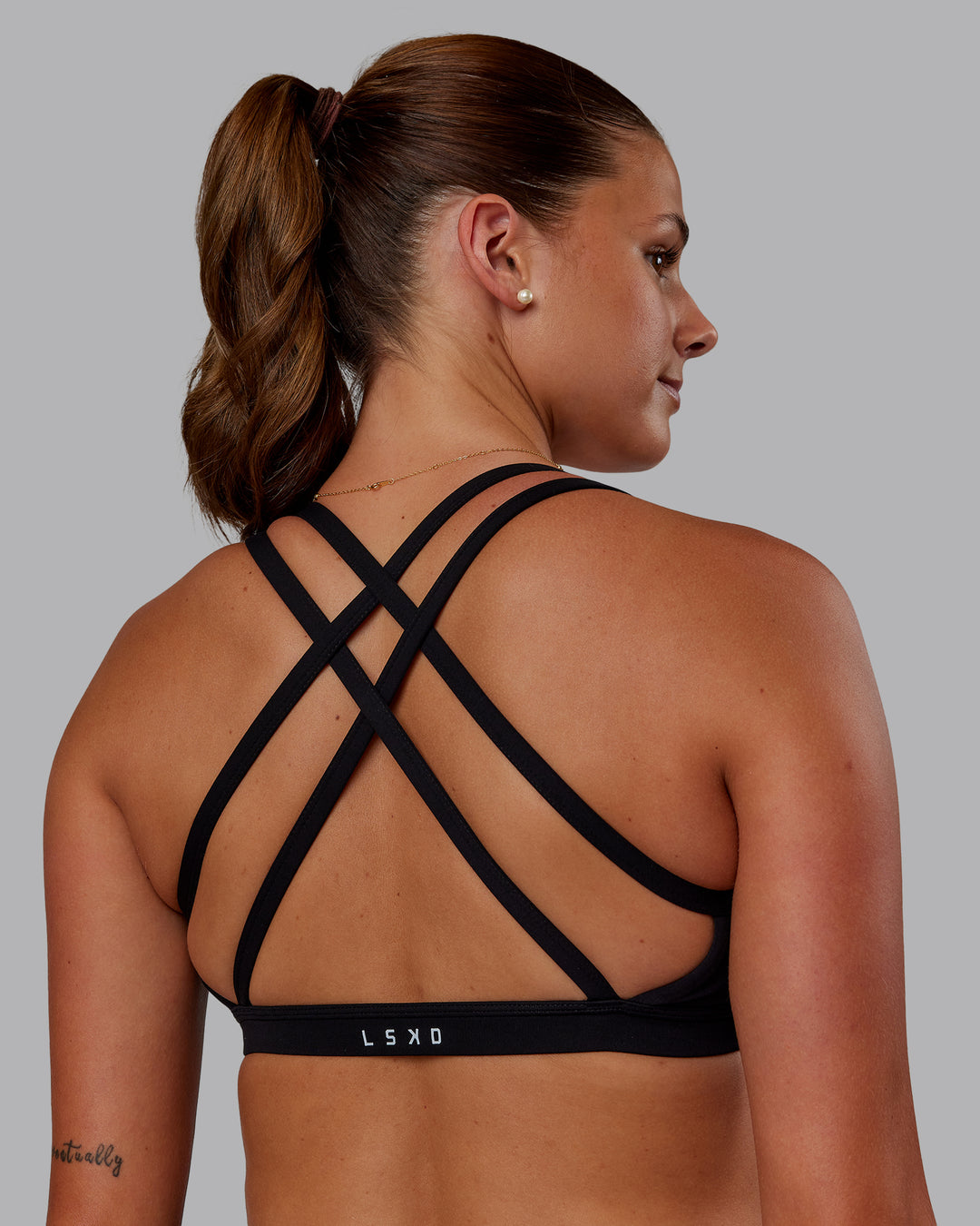 Woman wearing Velocity Sports Bra - Black | Model:Phoebe | Size:S - view 2
