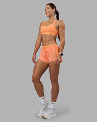 Woman wearing Velocity Sports Bra - Cantaloupe | Model:Hannah | Size:S | Thumbnail Index: 5