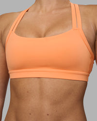 Woman wearing Velocity Sports Bra - Cantaloupe | Model:Hannah | Size:S | Thumbnail Index: 7