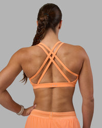 Woman wearing Velocity Sports Bra - Cantaloupe | Model:Hannah | Size:S | Thumbnail Index: 3