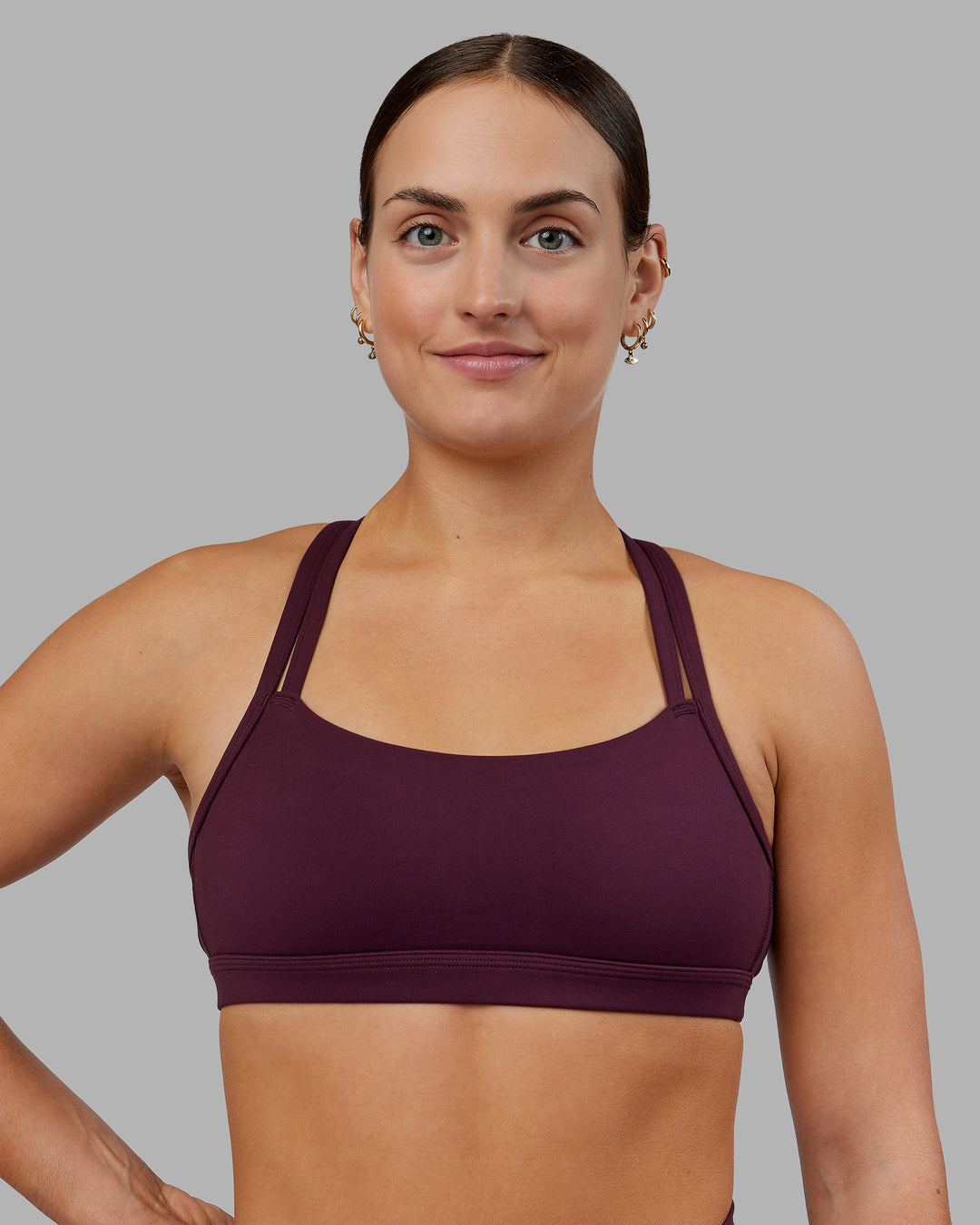 Woman wearing Velocity Sports Bra - Cherry Lacquer | Model:Keisha | Size:S - view 1