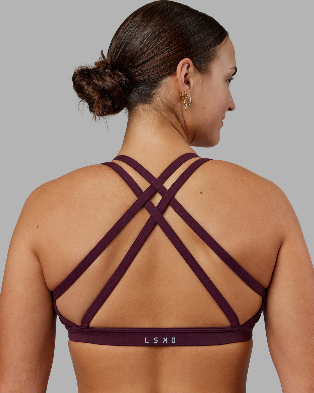 Woman wearing Velocity Sports Bra - Cherry Lacquer | Model:Keisha | Size:S - view 6