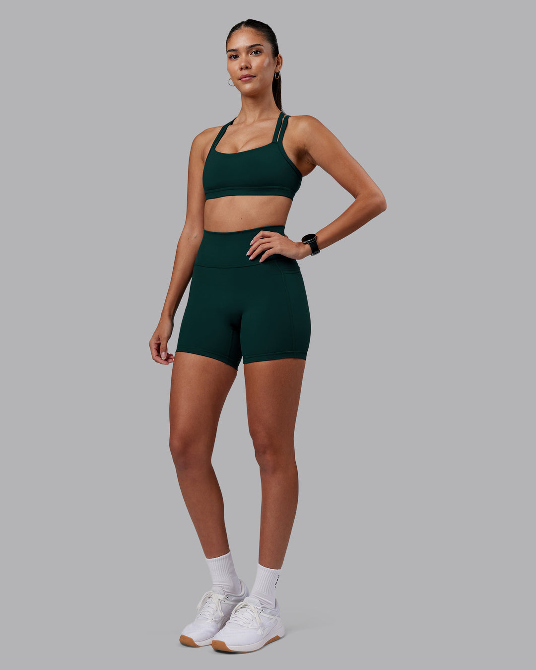 Woman wearing Velocity Sports Bra - Dark Moss | Model:Rhiley | Size:S - view 3
