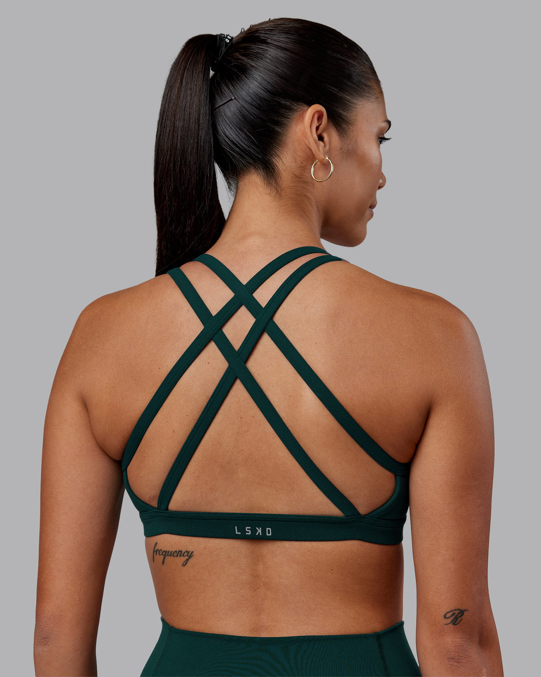 Woman wearing Velocity Sports Bra - Dark Moss | Model:Rhiley | Size:S - view 5