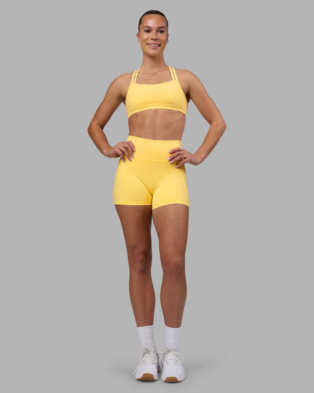 Woman wearing Velocity Sports Bra - Lemon | Model:Charlize | Size:S - view 4